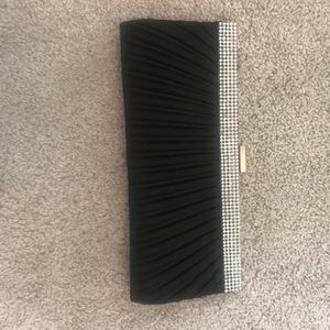 Black and sparkly clutch bag